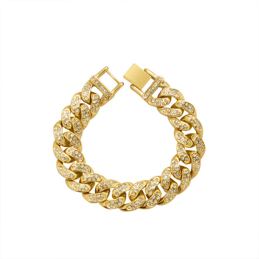 Chunky gold-tone Cuban link bracelet with clear cubic zirconia on bold interlocking links