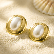 Chunky gold dome stud earrings with smooth resin centers displayed on a neutral background