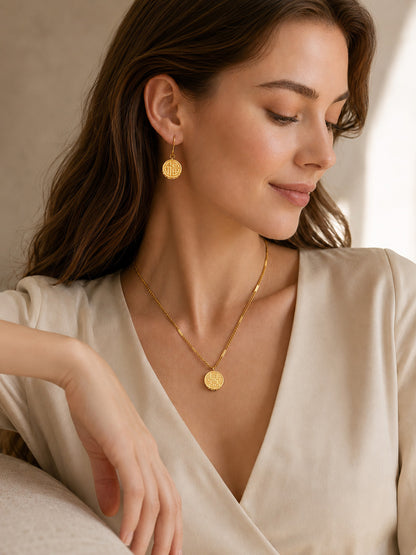 Gold-plated earrings matching the circular pendant necklace