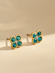 Turquoise clover zircon earrings close-up in polished 316L stainless steel jewelry