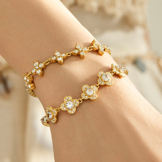 White and multicolor zircon clover link bracelets in gold and steel finishes