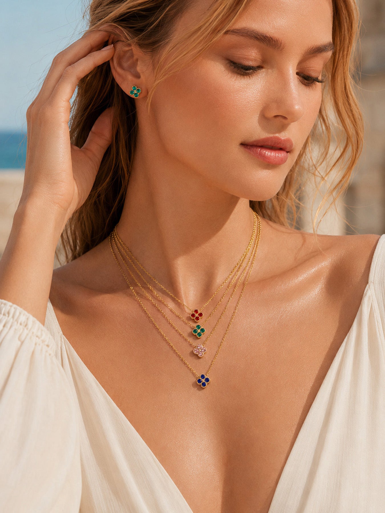 Elegant model styling with colorful clover zircon necklace for wholesale boutique jewelry buyers