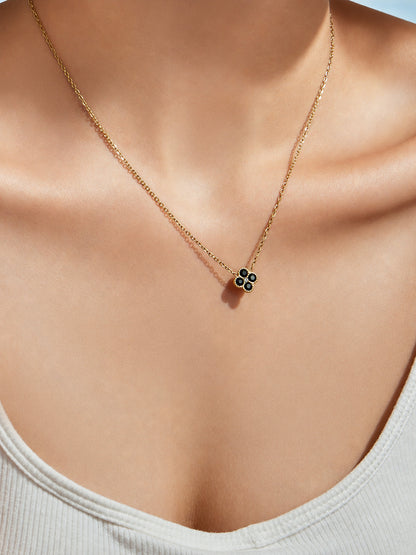 Neck close-up of colorful clover zircon pendant necklace in 316L stainless steel jewelry