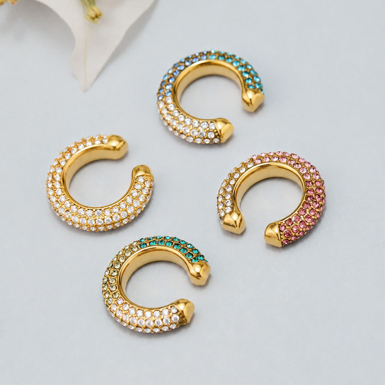 Colorful clip-on ear cuffs with pavé cubic zirconia in multiple finishes
