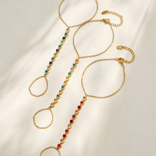 Colorful cubic zirconia hand chain bracelets displayed in multiple styles