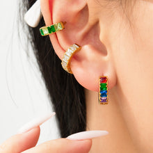 Colorful cubic zirconia stainless steel huggie earrings styled on ear