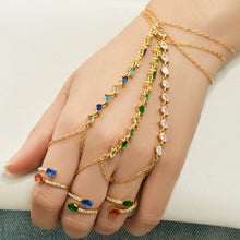 Gold-tone CZ hand chain bracelets with finger-chain loops styled together across the hand