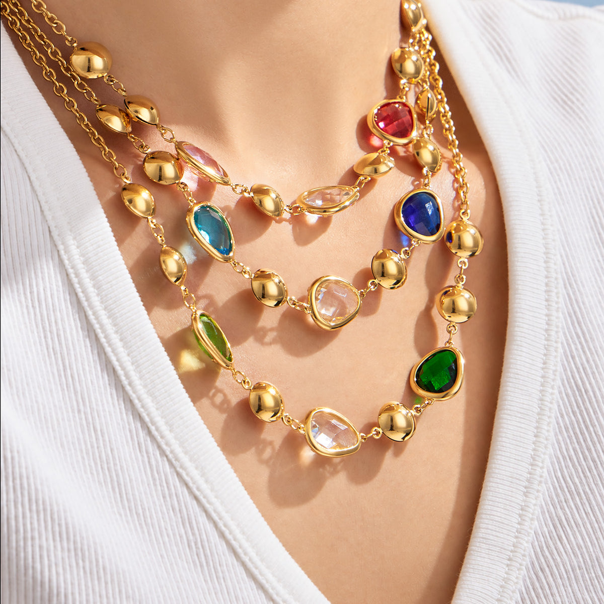 Colorful glass stone necklaces layered on model