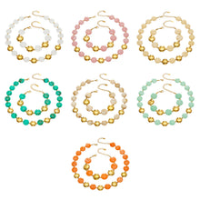 Overview of a colorful resin bead jewelry set with matching necklace and bracelet styles in multiple colorways with gold-tone accents.