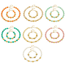 Collection image of colorful resin beaded necklace and bracelet sets with 316L stainless steel accents in multiple colorways.