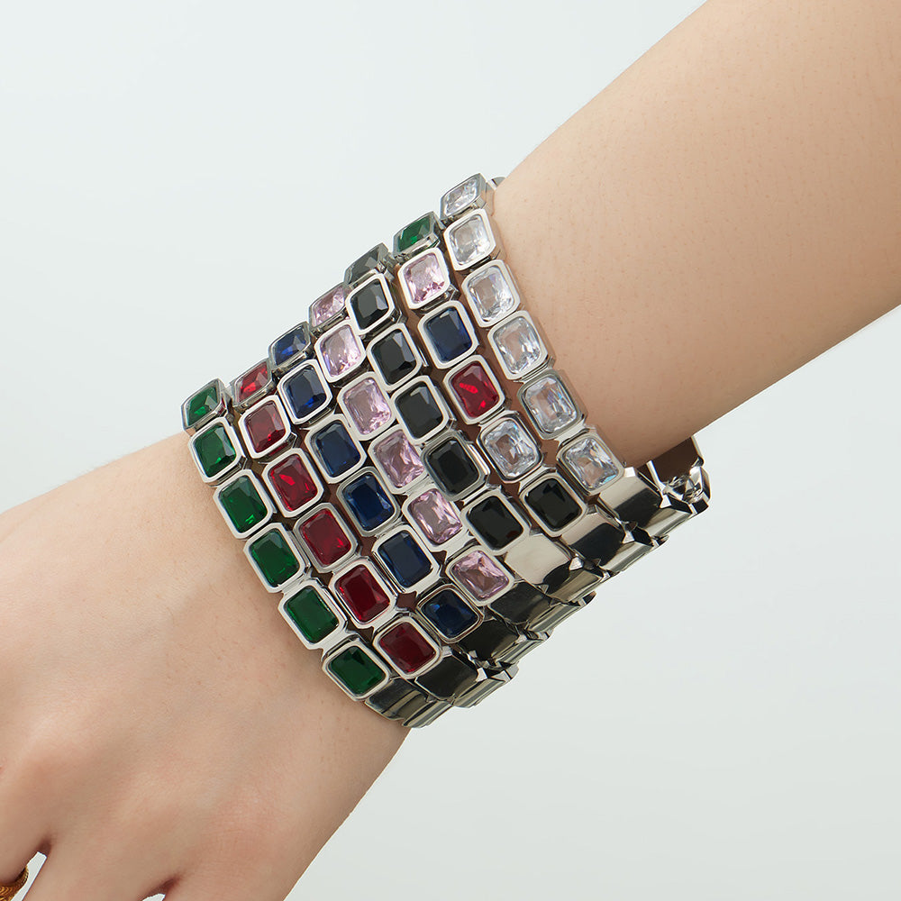 Silver stainless steel colorful square glass stone bangles stacked on wrist, fashion styling
