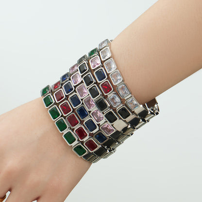 Silver stainless steel colorful square glass stone bangles stacked on wrist, fashion styling