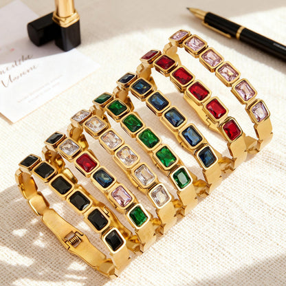 18K gold plated stainless steel colorful square glass stone bangles displayed on fabric surface