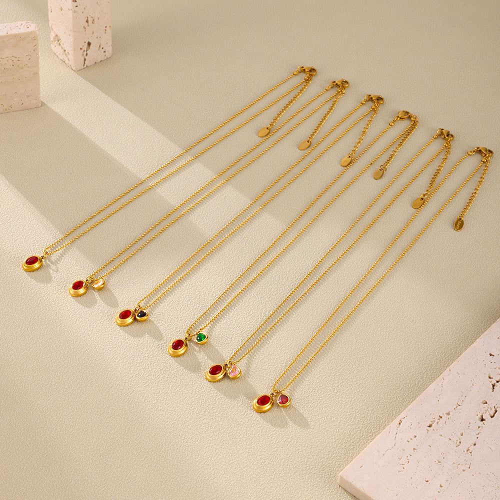 Colorful zircon ball chain necklaces arranged in a parallel flat lay