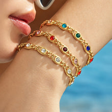 Colorful zircon bracelets stacked on wrist