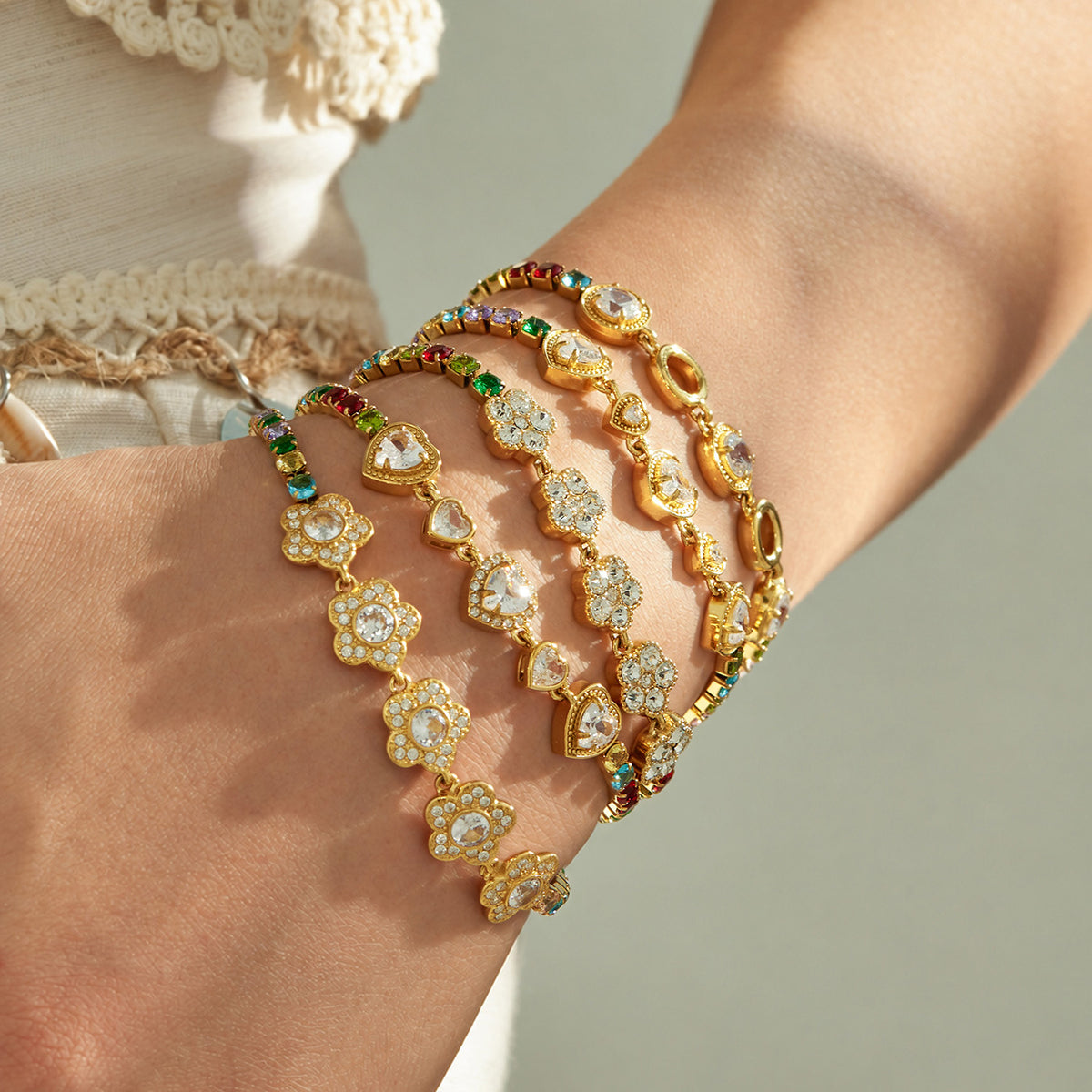 Colorful zircon bracelets stacked on wrist