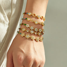 Colorful zircon bracelets layered on wrist