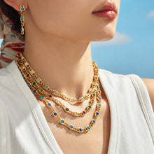 Colorful zircon necklaces layered on model