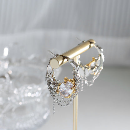Close-up of copper pearl zircon chain hoop earrings with decorative chain detail and statement hoop design