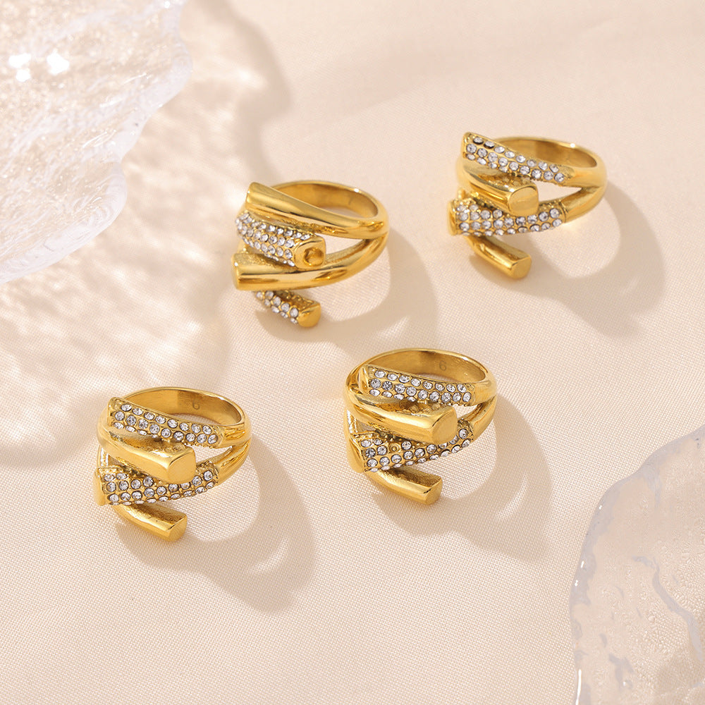 Close-up detail of crisscross cubic zirconia setting on stainless steel ring
