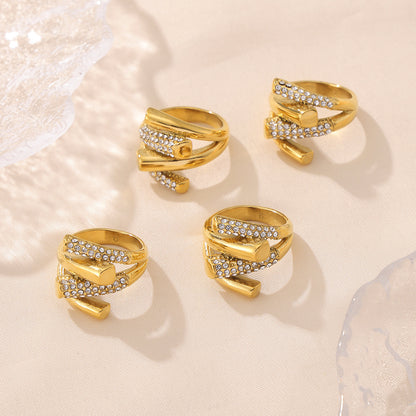 Close-up detail of crisscross cubic zirconia setting on stainless steel ring
