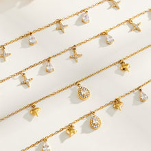 Gold-tone cross and heart charm jewelry with teardrop zircon details