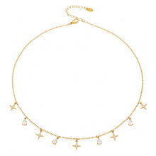 Stainless steel dainty cross and teardrop zircon charm necklace flat lay