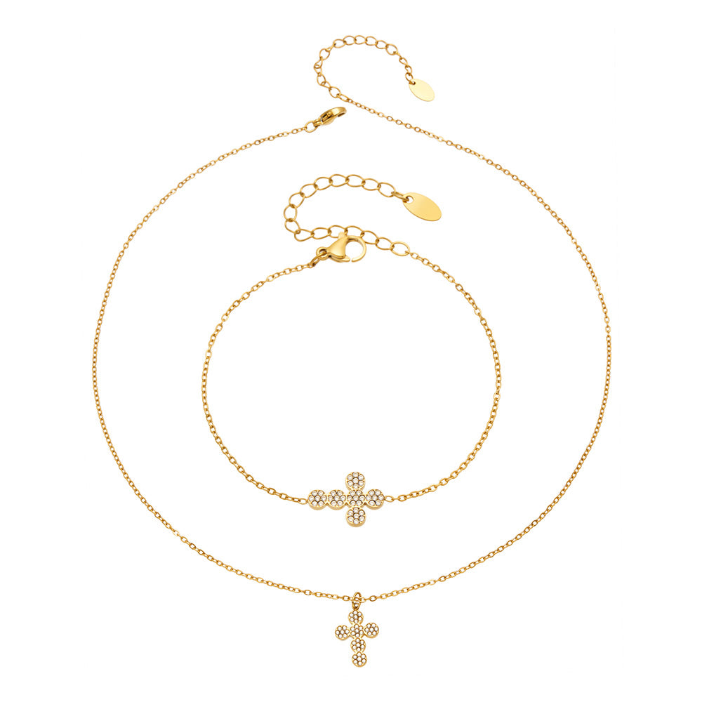 Gold cross zircon necklace and bracelet styles displayed together on a white background