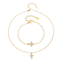 Gold cross zircon necklace and bracelet styles displayed together on a white background