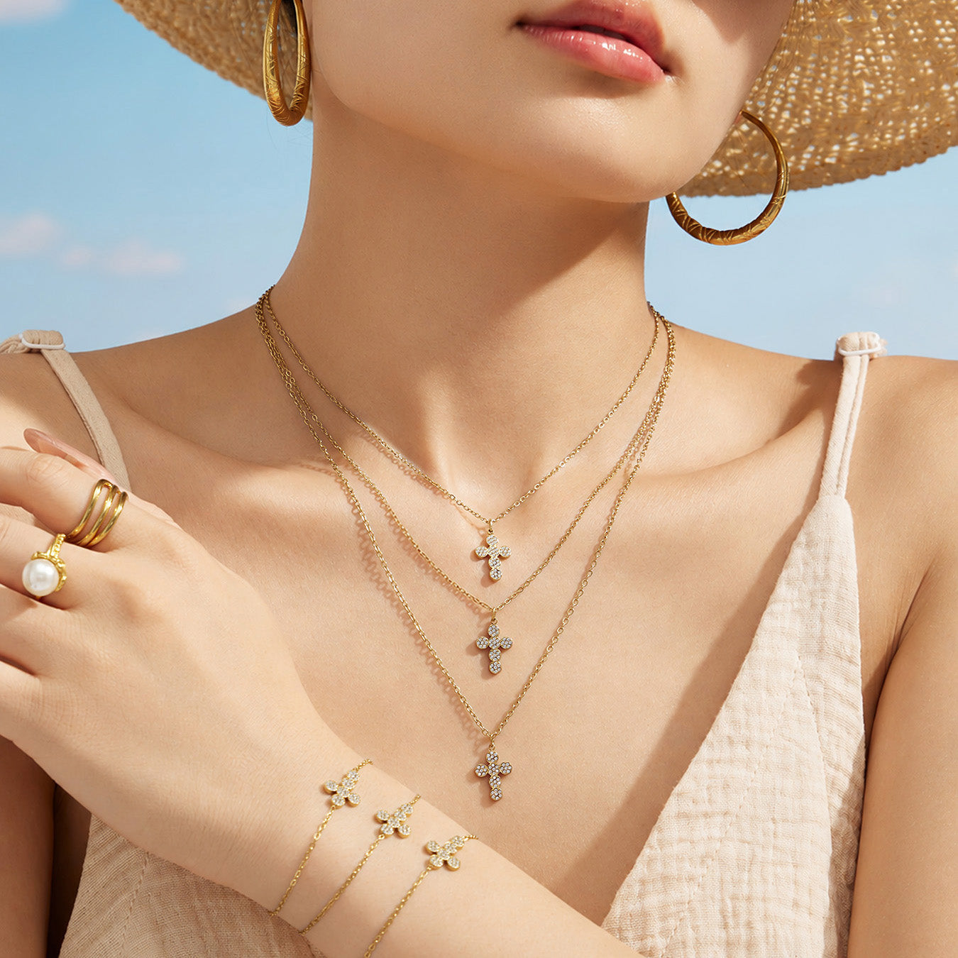 Front view of a model wearing a gold cross zircon pendant necklace