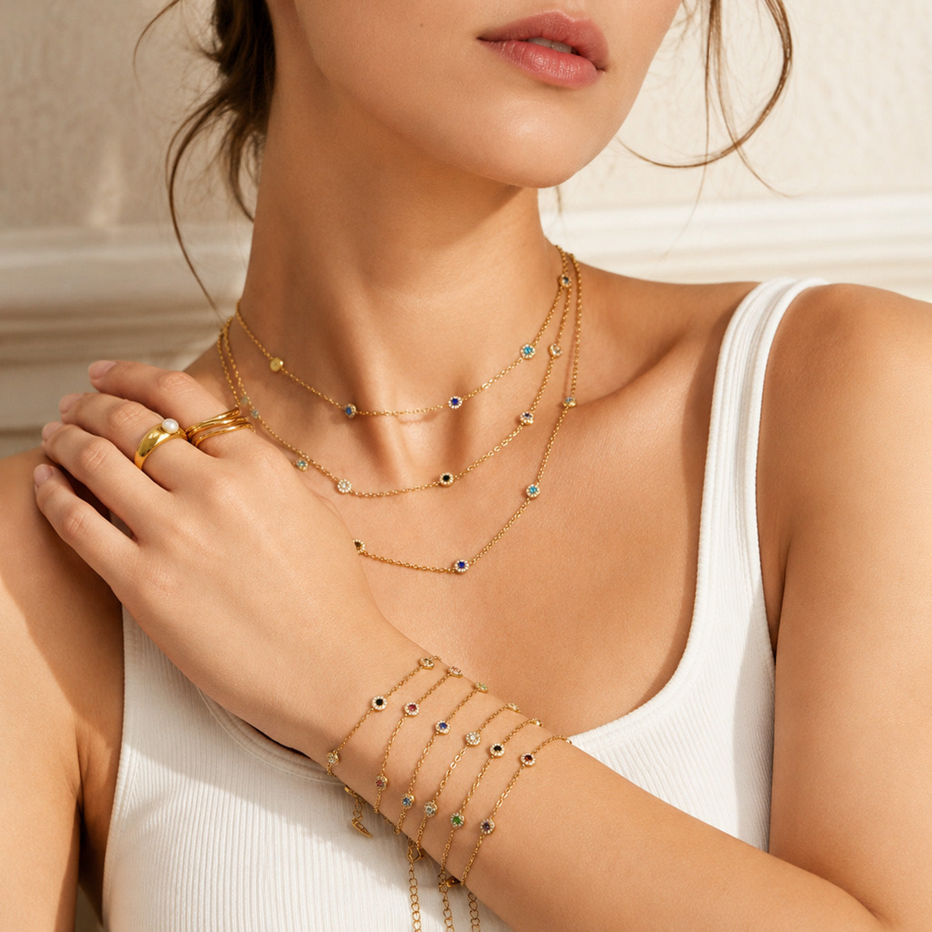 Model wearing a dainty gold cubic zirconia station necklace