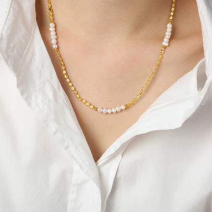 Gold plated pearl splice necklace styled in soft sunlight with freshwater pearl details for summer jewelry collections