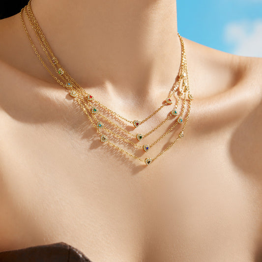 Gold colorful pavé CZ heart necklace and bracelet collection arranged for wholesale display