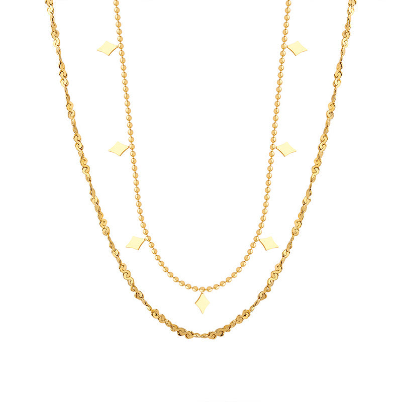 Double-layer geometric charm necklace in gold-tone stainless steel displayed on a white background