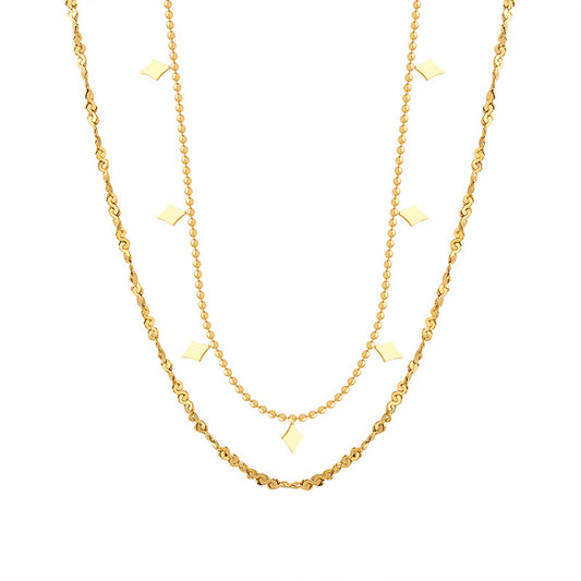 Double-layer geometric charm necklace in gold-tone stainless steel displayed on a white background