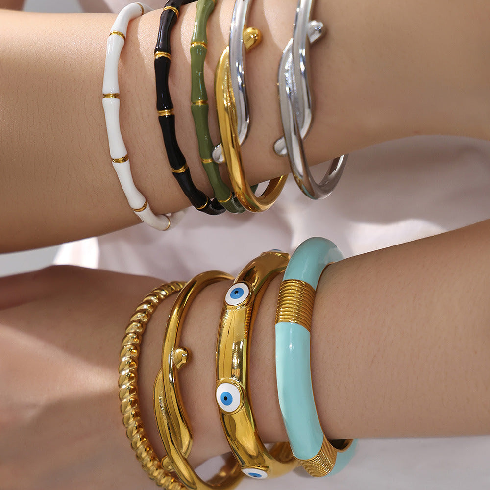 18k gold plated enamel stainless steel bangle set, model wearing on wrist