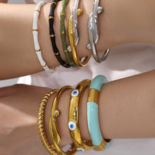18k gold plated enamel stainless steel bangle set, model wearing on wrist