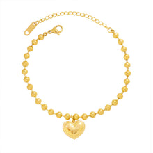 Gold engraved heart charm bracelet with polished beaded chain and adjustable extender