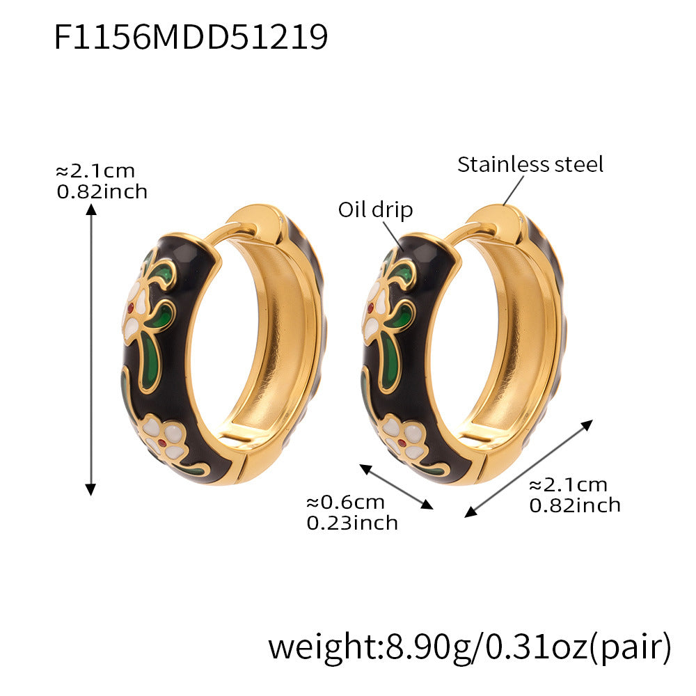 Black enamel floral hoop earrings in stainless steel, approx 2.1cm diameter, 0.6cm width, 8.9g per pair.