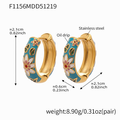 Blue enamel floral hoop earrings in stainless steel, approx 2.1cm diameter, 0.6cm width, 8.9g per pair.
