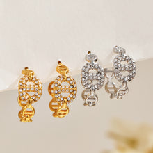 Gold and silver chain link hoop earrings displayed together with pavé zircon details for a mixed-metal assortment