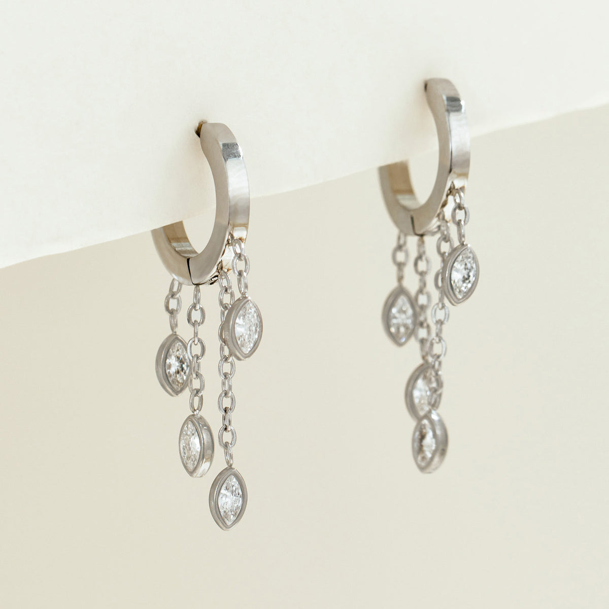 Silver stainless steel chain charm hoop earrings with three dangling marquise zircon details