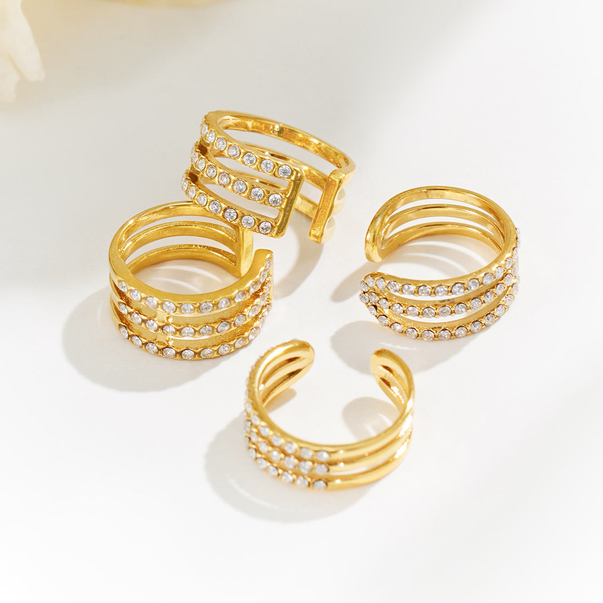 Gold zircon ear cuff assortment showing multiple layered cuff styles for boutique jewelry selection