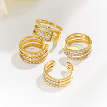 Gold zircon ear cuff assortment showing multiple layered cuff styles for boutique jewelry selection