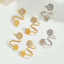 Gold and silver flower ear cuffs displayed together with zircon-set floral tops and non-pierced designs