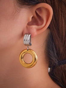 F483 two-tone large round stainless steel door knocker earrings worn by model
