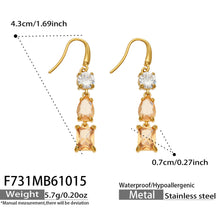 Product dimension diagram of champagne-colored gold drop earrings showing three mixed-cut stones and curved fishhook wires