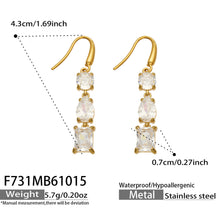 Size diagram of clear three-stone gold drop earrings showing fishhook wires, overall hanging length and stone measurements