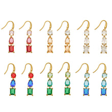 Gold-tone stainless steel three-stone drop earrings displayed in six color combinations with fishhook wires and mixed-cut stones