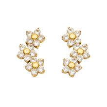Pair of gold-tone stainless steel flower cluster earrings featuring three cascading flowers with clear faceted stone petals and gold centers